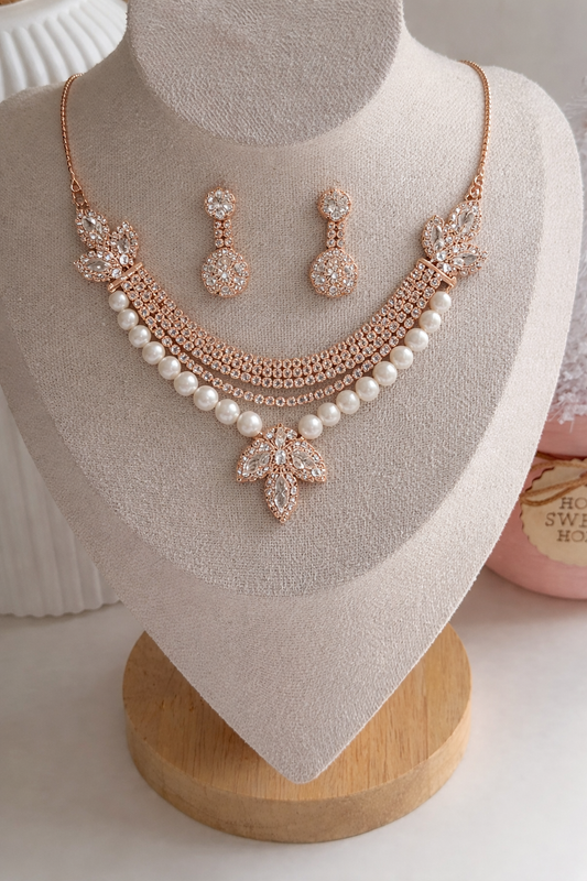 Jewelry set with necklace and earrings on a mannequin bust.